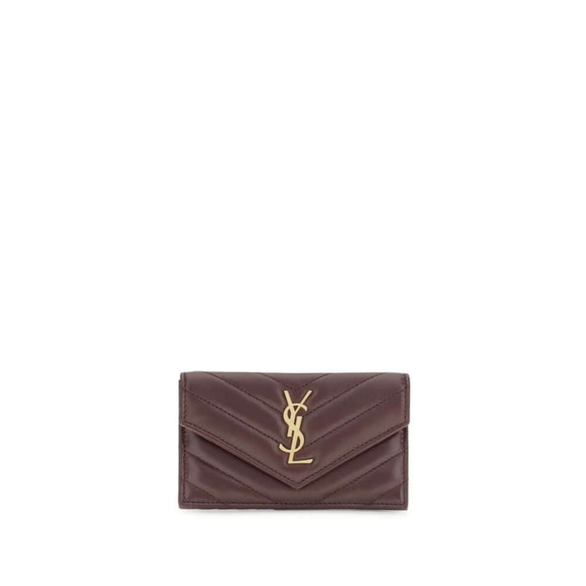 Bordeaux Lamb Ovis Aries Aries WalletSaint Laurent’s Cassandre Matelassé Card Holder combines elegance and functionality in a compact design. Featuring chevron stitching and the distinctive Cassandre decoration, it has a zipper, flap and card slots on the
