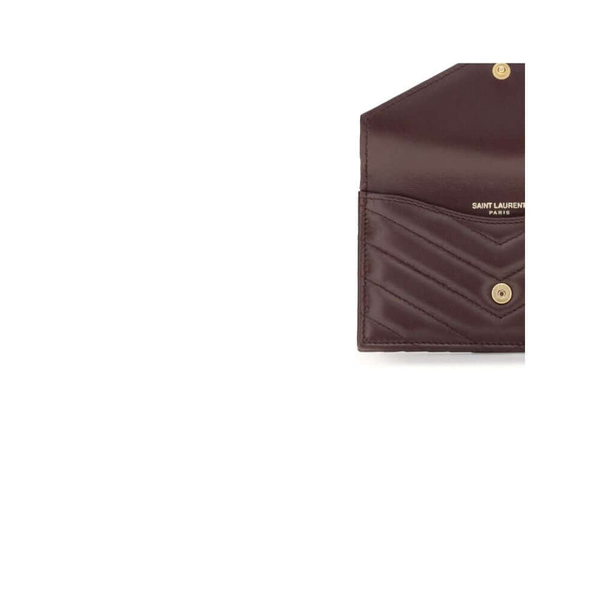 Bordeaux Lamb Ovis Aries Aries WalletSaint Laurent’s Cassandre Matelassé Card Holder combines elegance and functionality in a compact design. Featuring chevron stitching and the distinctive Cassandre decoration, it has a zipper, flap and card slots on the