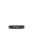 Brown Leather Regular BeltFerragamo’s Gancini Belt is a reversible, adjustable model designed for versatile elegance. The stitched rod lends a casual touch, while the ruthenium-finish buckle, with stylized double Gancini, adds character and sophistication