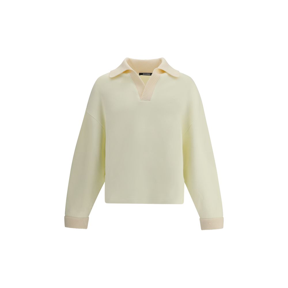Cream Cotton SweatshirtThe polo Sweatshirt by Jacquemus is a garment that blends the elegance of the polo shirt with the relaxed spirit of the sweatshirt. Made of soft cotton, it is embellished with a ribbed wool collar and cuffs that add structure and a
