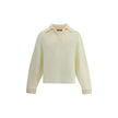 Cream Cotton SweatshirtThe polo Sweatshirt by Jacquemus is a garment that blends the elegance of the polo shirt with the relaxed spirit of the sweatshirt. Made of soft cotton, it is embellished with a ribbed wool collar and cuffs that add structure and a