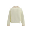 Cream Cotton SweatshirtThe polo Sweatshirt by Jacquemus is a garment that blends the elegance of the polo shirt with the relaxed spirit of the sweatshirt. Made of soft cotton, it is embellished with a ribbed wool collar and cuffs that add structure and a