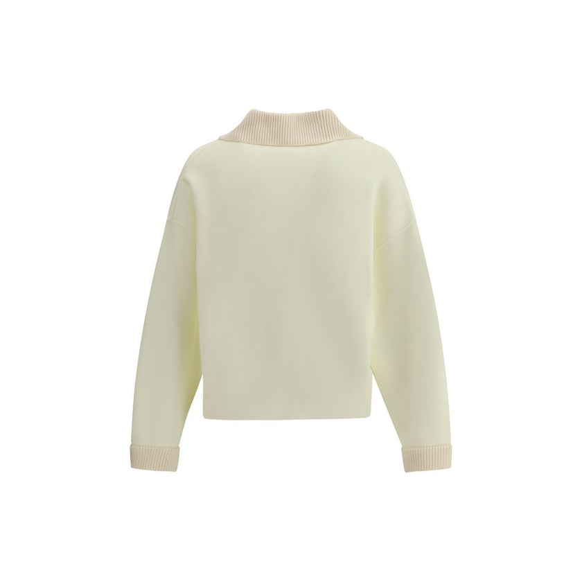 Cream Cotton SweatshirtThe polo Sweatshirt by Jacquemus is a garment that blends the elegance of the polo shirt with the relaxed spirit of the sweatshirt. Made of soft cotton, it is embellished with a ribbed wool collar and cuffs that add structure and a