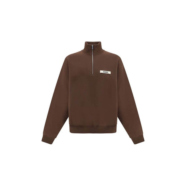Brown Cotton SweatshirtThe cotton Le Camionneur Sweatshirt by Jacquemus features a plush interior for optimal comfort. The brand’s iconic monogram patch applied to the front adds a distinctive touch, while the ribbed cuffs and hem ensure a comfortable, fi