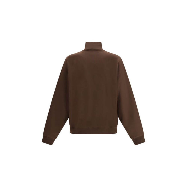 Brown Cotton SweatshirtThe cotton Le Camionneur Sweatshirt by Jacquemus features a plush interior for optimal comfort. The brand’s iconic monogram patch applied to the front adds a distinctive touch, while the ribbed cuffs and hem ensure a comfortable, fi