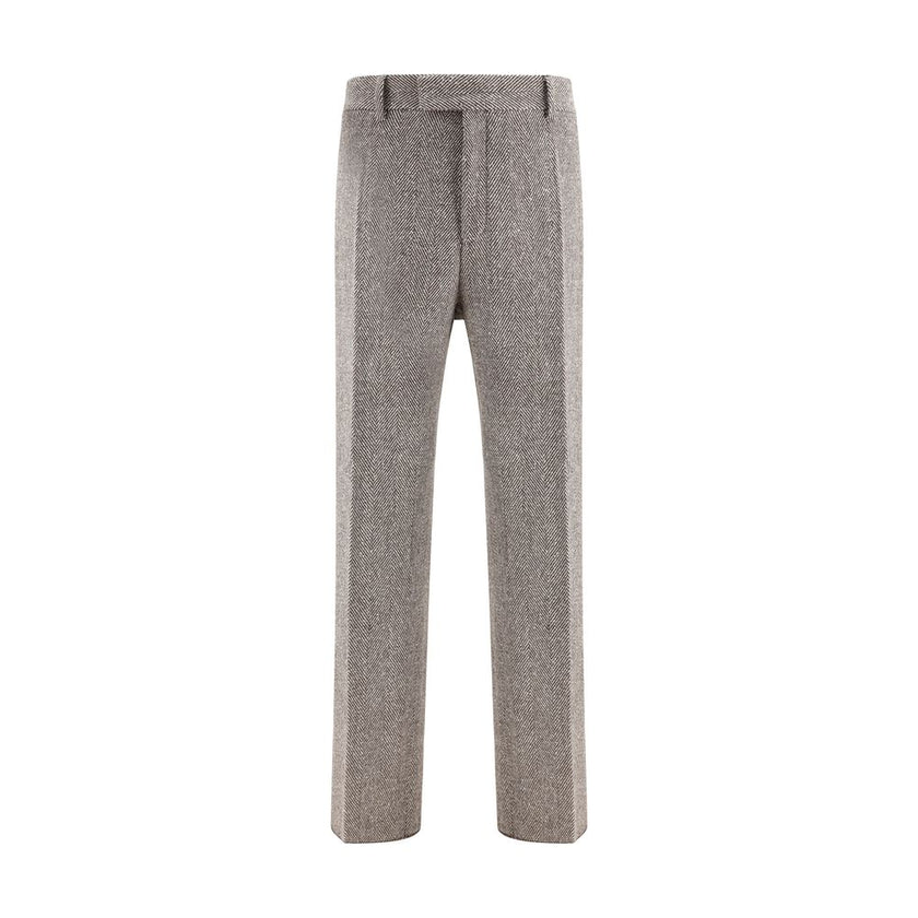 Gray Fleece Wool Casual PantsFerragamo’s wide chevron Pants recalls the timeless elegance of the 1920s with a refined, flowing silhouette. Crafted with tailored construction, it features a wide leg with an ironed crease that enhances the movement of the f