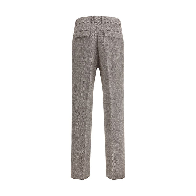 Gray Fleece Wool Casual PantsFerragamo’s wide chevron Pants recalls the timeless elegance of the 1920s with a refined, flowing silhouette. Crafted with tailored construction, it features a wide leg with an ironed crease that enhances the movement of the f