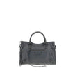 Le City Medium Shoulder BagBalenciaga’s Le City Medium Shoulder Bag is a high-class item made of fine lambskin leather that combines elegance and functionality. The two hand-woven leather handles lend an artisanal and refined touch, while the adjustable a