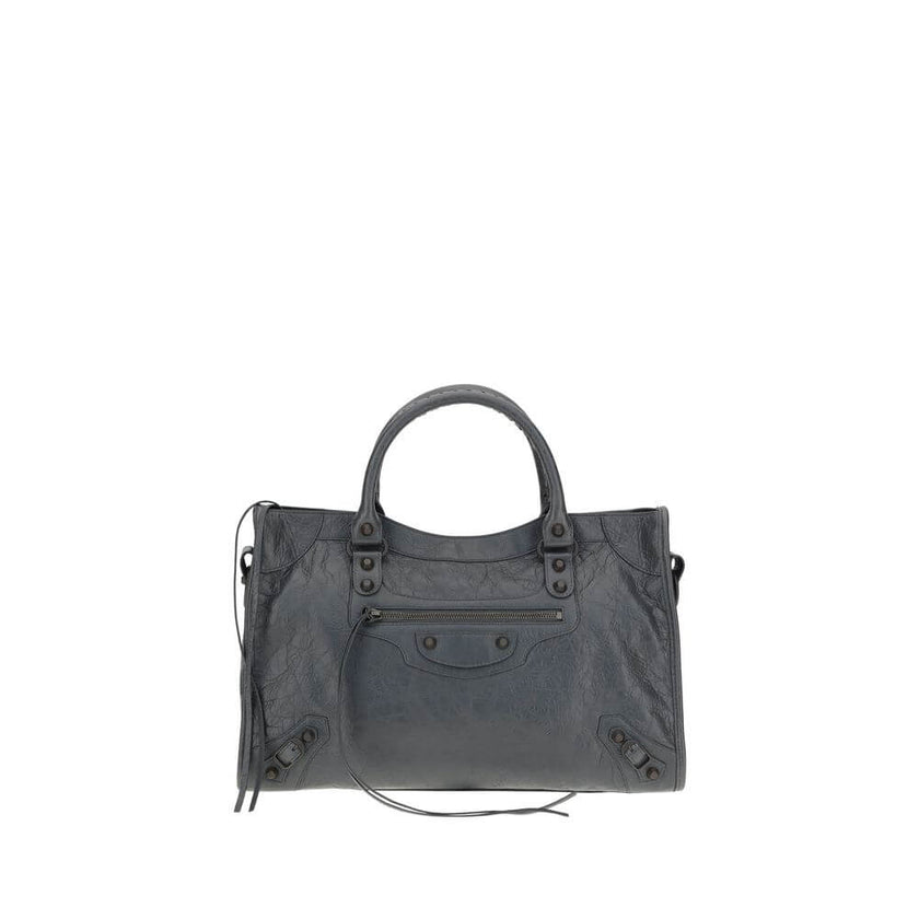 Le City Medium Shoulder BagBalenciaga’s Le City Medium Shoulder Bag is a high-class item made of fine lambskin leather that combines elegance and functionality. The two hand-woven leather handles lend an artisanal and refined touch, while the adjustable a