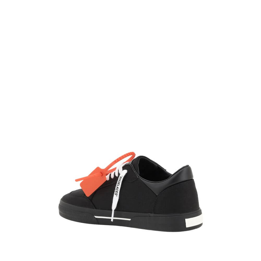 New Low Vulcanized SneakersCotton New Low Vulcanized Sneakers by Off-White feature a lace-up front closure and a round toe. The side panels are decorated with the brand’s iconic Arrow logo, while the flat sole ensures comfort. A distinctive detail is the