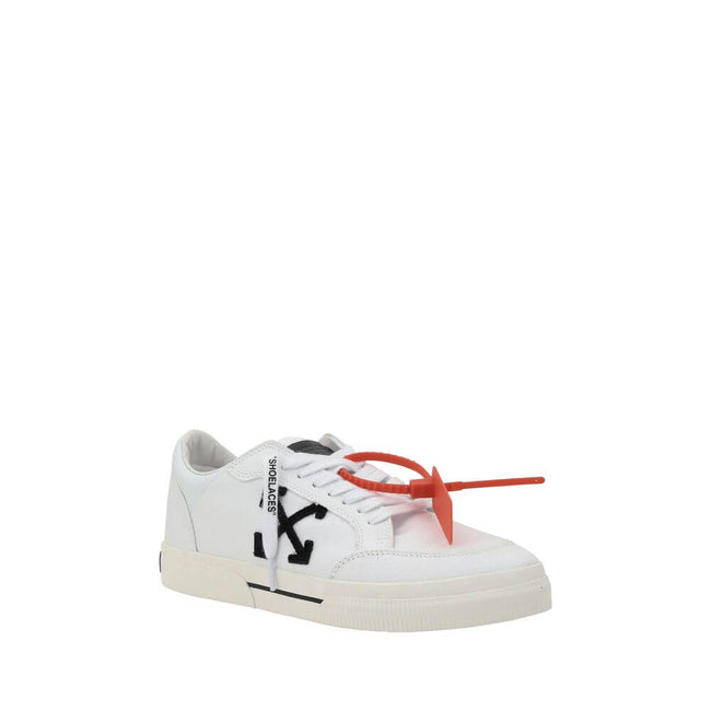 White Rubber Low Top SneakersCotton New Low Vulcanized Sneakers by Off-White feature a lace-up front closure and a round toe. The side panels are decorated with the brand’s iconic Arrow logo, while the flat sole ensures comfort. A distinctive detail is th