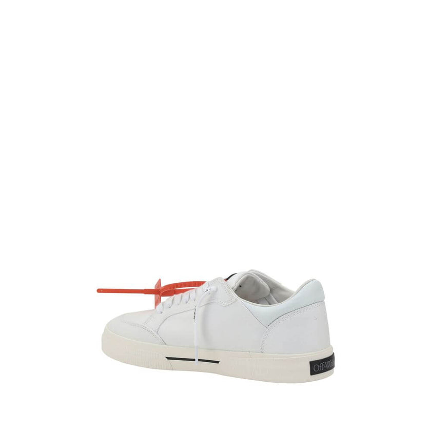 White Rubber Low Top SneakersCotton New Low Vulcanized Sneakers by Off-White feature a lace-up front closure and a round toe. The side panels are decorated with the brand’s iconic Arrow logo, while the flat sole ensures comfort. A distinctive detail is th
