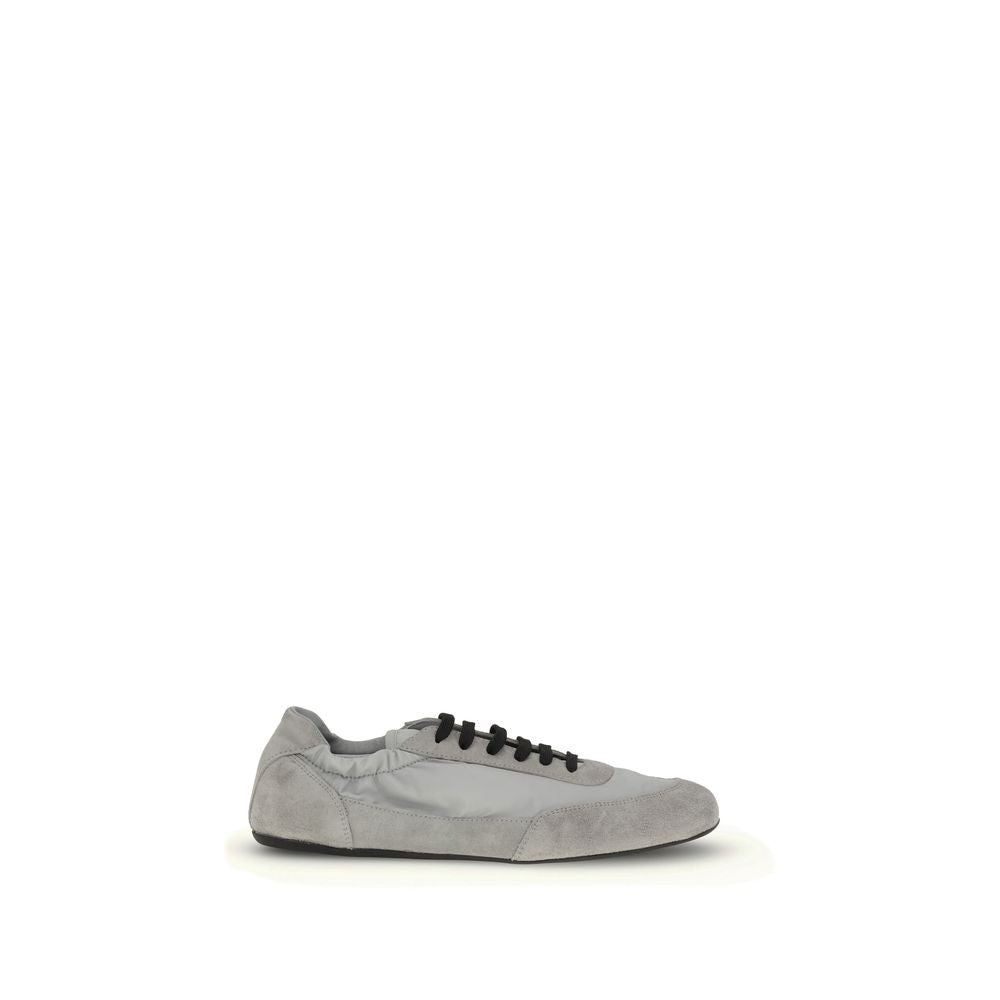 Gray Rubber Athletic SneakersPrada’s Sneakers feature a round toe and suede details, with front lace-up closure for a comfortable fit. The brand’s iconic monogram can be seen in contrast on the front, while the elasticized ankle lap ensures added comfort.