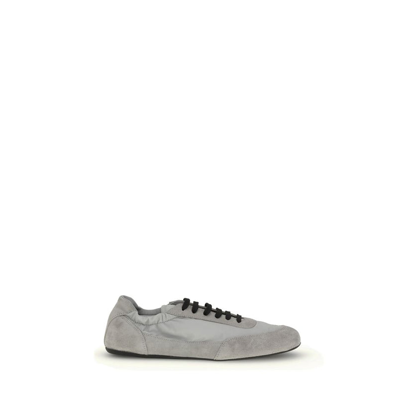 Gray Rubber Athletic SneakersPrada’s Sneakers feature a round toe and suede details, with front lace-up closure for a comfortable fit. The brand’s iconic monogram can be seen in contrast on the front, while the elasticized ankle lap ensures added comfort.