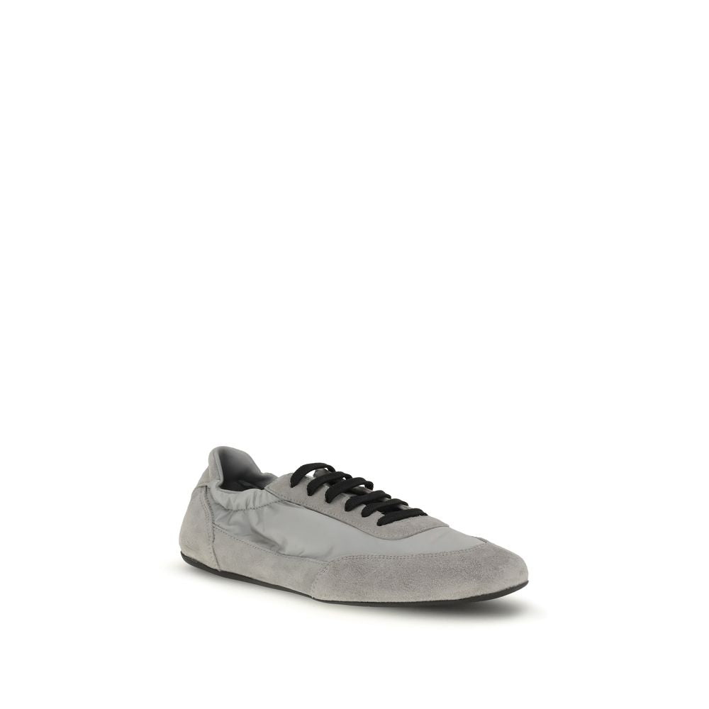 Gray Rubber Athletic SneakersPrada’s Sneakers feature a round toe and suede details, with front lace-up closure for a comfortable fit. The brand’s iconic monogram can be seen in contrast on the front, while the elasticized ankle lap ensures added comfort.