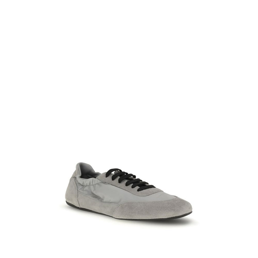 Gray Rubber Athletic SneakersPrada’s Sneakers feature a round toe and suede details, with front lace-up closure for a comfortable fit. The brand’s iconic monogram can be seen in contrast on the front, while the elasticized ankle lap ensures added comfort.