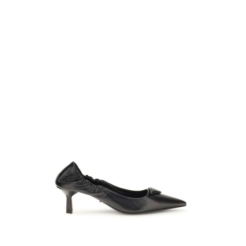 Black Calf Leather Bos Taurus High Heel PumpsPrada’s logo Pumps are made of leather and feature a soft, tapered silhouette. The pointed toe model features a deconstructed design, enhanced by an elastic back that ensures comfort and fit. The architectural