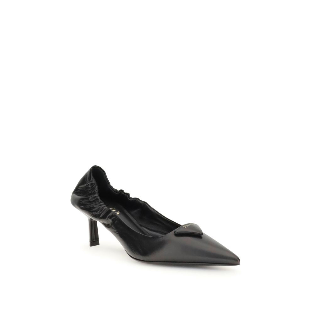 Black Calf Leather Bos Taurus High Heel PumpsPrada’s logo Pumps are made of leather and feature a soft, tapered silhouette. The pointed toe model features a deconstructed design, enhanced by an elastic back that ensures comfort and fit. The architectural