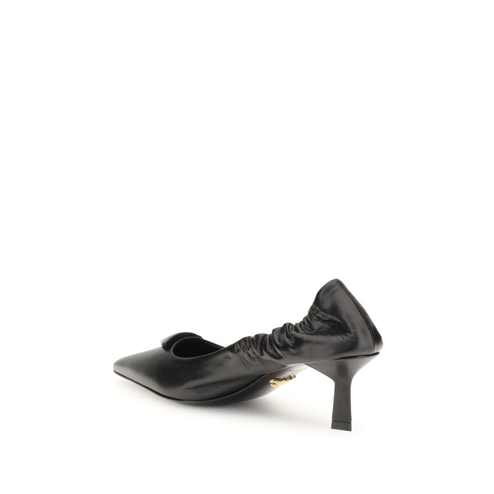 Black Calf Leather Bos Taurus High Heel PumpsPrada’s logo Pumps are made of leather and feature a soft, tapered silhouette. The pointed toe model features a deconstructed design, enhanced by an elastic back that ensures comfort and fit. The architectural
