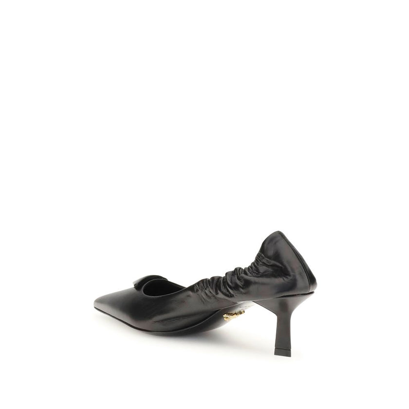 Black Calf Leather Bos Taurus High Heel PumpsPrada’s logo Pumps are made of leather and feature a soft, tapered silhouette. The pointed toe model features a deconstructed design, enhanced by an elastic back that ensures comfort and fit. The architectural