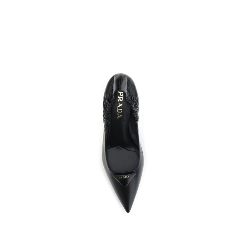 Black Calf Leather Bos Taurus High Heel PumpsPrada’s logo Pumps are made of leather and feature a soft, tapered silhouette. The pointed toe model features a deconstructed design, enhanced by an elastic back that ensures comfort and fit. The architectural