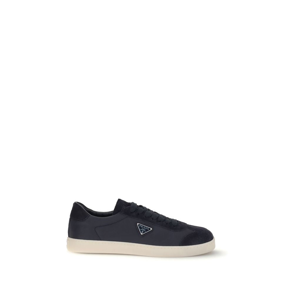 Blue Leather SneakersLeather Sneakers by Prada combine contemporary style with everyday comfort. Featuring a flat rubber sole and round toe, they are distinguished by the iconic triangular side-applied plaque and tone-on-tone logo on the back, adding a di
