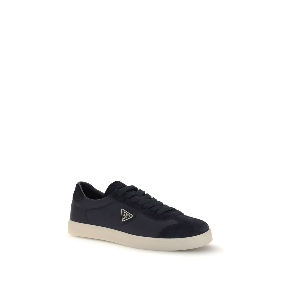 Blue Leather SneakersLeather Sneakers by Prada combine contemporary style with everyday comfort. Featuring a flat rubber sole and round toe, they are distinguished by the iconic triangular side-applied plaque and tone-on-tone logo on the back, adding a di