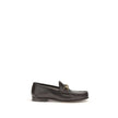 Brown Calf Leather Bos Taurus Slip-On Loafers1953 Horsebit Loafers by Gucci celebrate the house’s timeless elegance with a classic and iconic design. Crafted in dark brown leather, they are embellished with the Horsebit detail with gold-tone hardware. Par