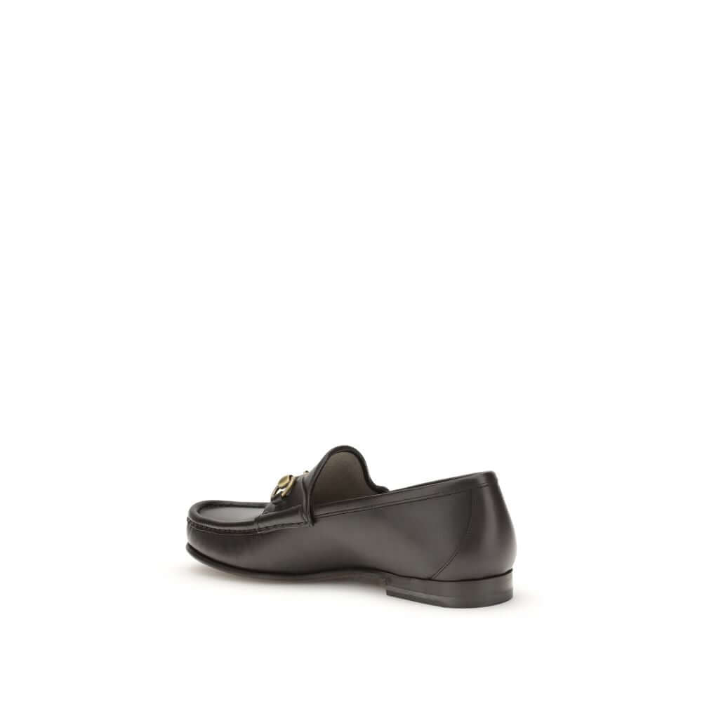 Brown Calf Leather Bos Taurus Slip-On Loafers1953 Horsebit Loafers by Gucci celebrate the house’s timeless elegance with a classic and iconic design. Crafted in dark brown leather, they are embellished with the Horsebit detail with gold-tone hardware. Par