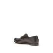 Brown Calf Leather Bos Taurus Slip-On Loafers1953 Horsebit Loafers by Gucci celebrate the house’s timeless elegance with a classic and iconic design. Crafted in dark brown leather, they are embellished with the Horsebit detail with gold-tone hardware. Par