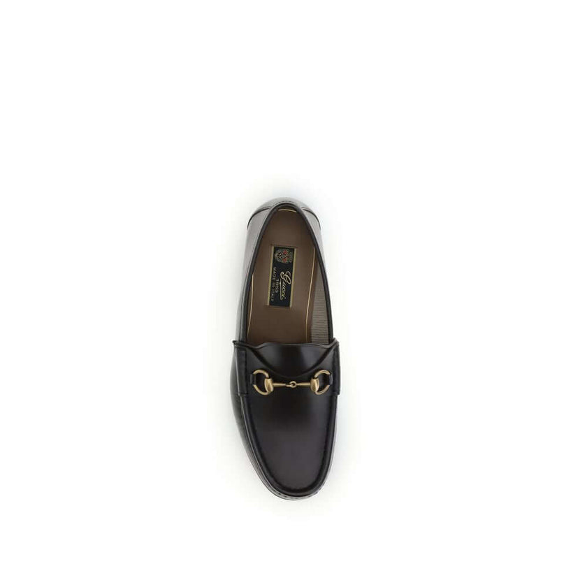 Brown Calf Leather Bos Taurus Slip-On Loafers1953 Horsebit Loafers by Gucci celebrate the house’s timeless elegance with a classic and iconic design. Crafted in dark brown leather, they are embellished with the Horsebit detail with gold-tone hardware. Par