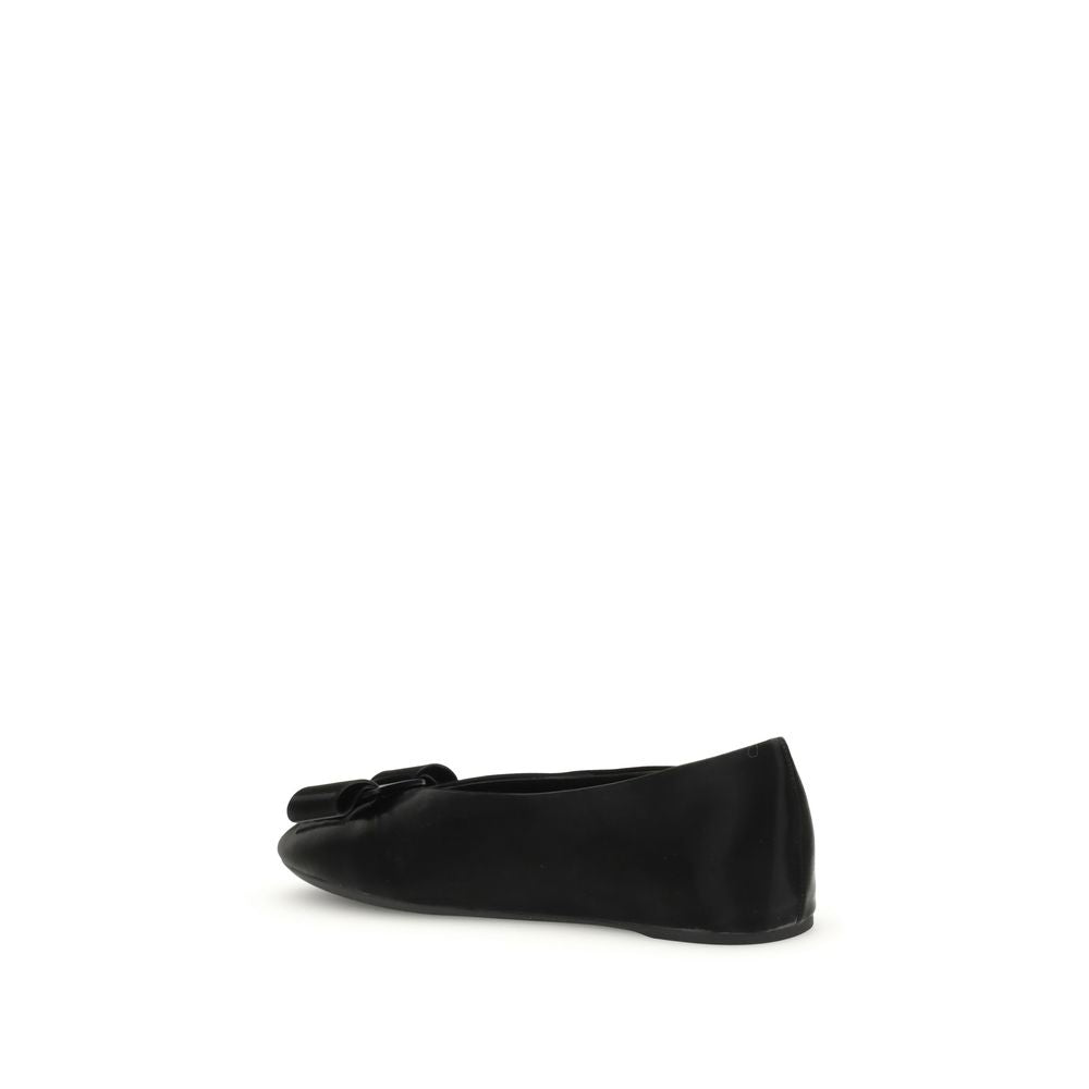 Black Calf Leather Bos Taurus Ballet FlatsFerragamo’s Vara bow Ballerinas combine elegance and versatility in a refined design. Made of soft leather with pouch construction, they offer flexibility and an unstructured fit. The low-cut cut and rounded toe a