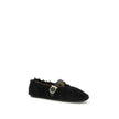 Black Fur Ballet FlatsFerragamo’s Gancini-embellished Ballerinas by Ferragamo reinterprets a classic with a playful, contemporary twist. Featuring a contoured neckline and soft silhouette, it is distinguished by a curly shearling lining, ideal for the col