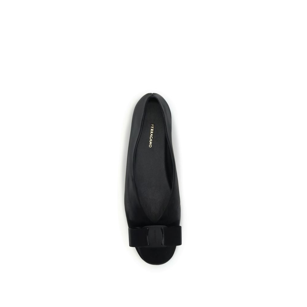 Black Calf Leather Bos Taurus Ballet FlatsFerragamo’s Vara bow Ballerinas combine elegance and versatility in a refined design. Made of soft leather with pouch construction, they offer flexibility and an unstructured fit. The low-cut cut and rounded toe a