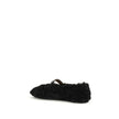 Black Fur Ballet FlatsFerragamo’s Gancini-embellished Ballerinas by Ferragamo reinterprets a classic with a playful, contemporary twist. Featuring a contoured neckline and soft silhouette, it is distinguished by a curly shearling lining, ideal for the col