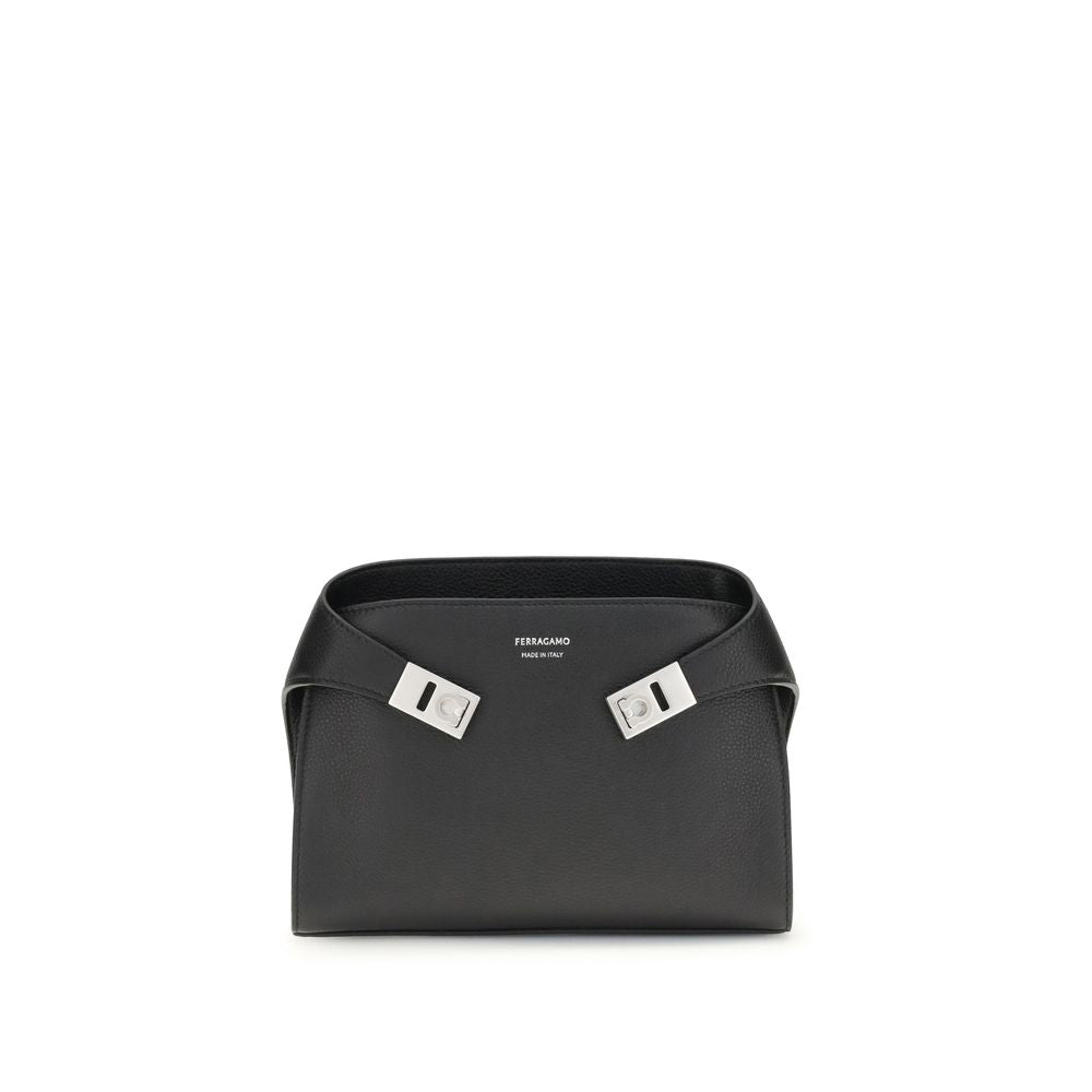 Leather Hug Fanny PackThe leather Hug Fanny Pack by Ferragamo reinterprets the iconic shapes of the collection in a compact and elegant version. Made of fine leather, it opens with a bridge and double magnet, revealing an interior also lined in leather. V