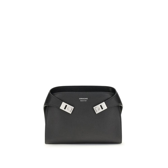 Leather Hug Fanny PackThe leather Hug Fanny Pack by Ferragamo reinterprets the iconic shapes of the collection in a compact and elegant version. Made of fine leather, it opens with a bridge and double magnet, revealing an interior also lined in leather. V