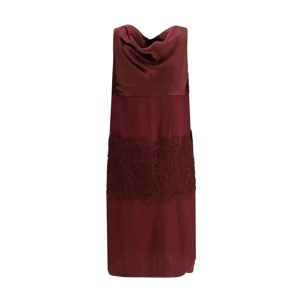 Bordeaux Silk Cocktail DressFerragamo’s Draped Dress is a refined contemporary reinterpretation of 1920s elegance. Made of a blend of silk chiffon, satin, and embroidery, it is distinguished by wide bands that wrap the silhouette harmoniously. The draped