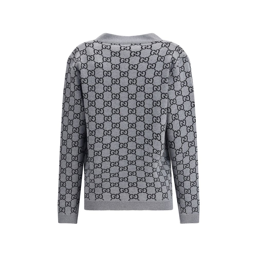 Black Wool CardiganGucci’s GG Supreme reversible Cardigan is made of fine wool tubular jacquard in shades of black and white with the iconic GG pattern. Featuring a V-neckline, low shoulders and long sleeves, it has two front pockets and ribbed trim. A ve