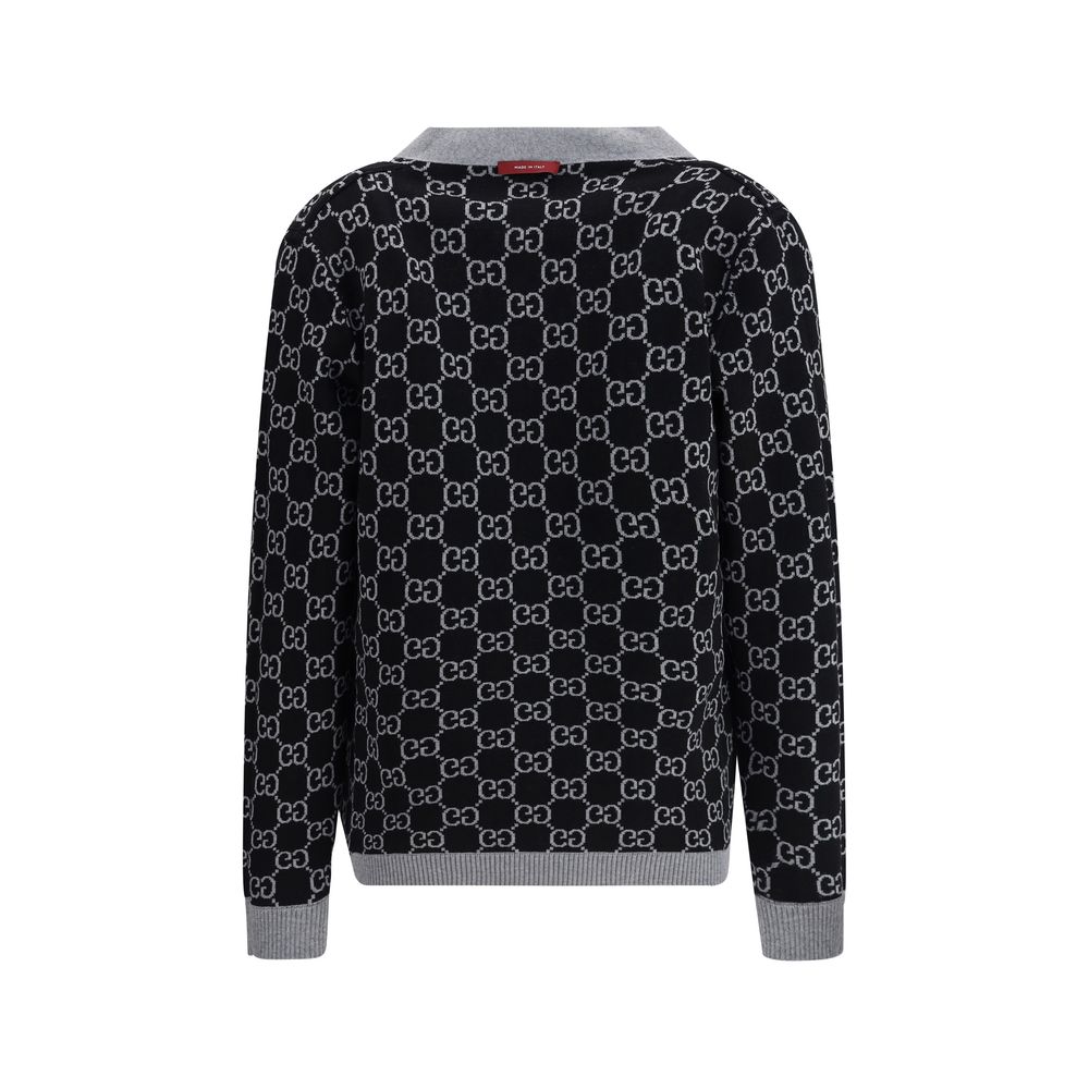 Black Wool CardiganGucci’s GG Supreme reversible Cardigan is made of fine wool tubular jacquard in shades of black and white with the iconic GG pattern. Featuring a V-neckline, low shoulders and long sleeves, it has two front pockets and ribbed trim. A ve