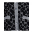 Black Wool CardiganGucci’s GG Supreme reversible Cardigan is made of fine wool tubular jacquard in shades of black and white with the iconic GG pattern. Featuring a V-neckline, low shoulders and long sleeves, it has two front pockets and ribbed trim. A ve