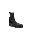 Black Calf Leather Bos Taurus Ankle BootsBurberry’s Buckle Ankle Boots combine contemporary style and functionality. Featuring a rounded toe and an above-ankle height, they have a handy pull-on back for easy on-and-off wear. The logo buckle on the ankle a
