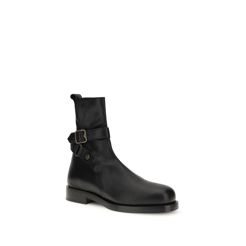 Black Calf Leather Bos Taurus Ankle BootsBurberry’s Buckle Ankle Boots combine contemporary style and functionality. Featuring a rounded toe and an above-ankle height, they have a handy pull-on back for easy on-and-off wear. The logo buckle on the ankle a