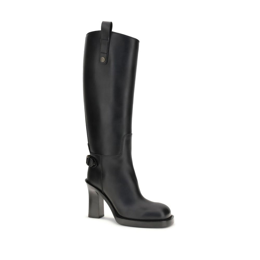 Black Calf Leather Bos Taurus High Heel BootsBurberry’s Cavalier High Boots, inspired by the brand’s equestrian tradition, are crafted in Italy from smooth calfskin. With a column silhouette that reaches to the knee, they feature side tabs, buckled ankle