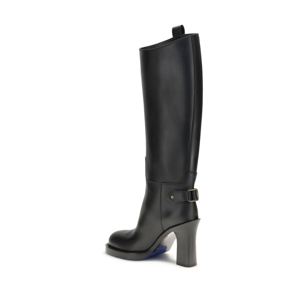 Black Calf Leather Bos Taurus High Heel BootsBurberry’s Cavalier High Boots, inspired by the brand’s equestrian tradition, are crafted in Italy from smooth calfskin. With a column silhouette that reaches to the knee, they feature side tabs, buckled ankle