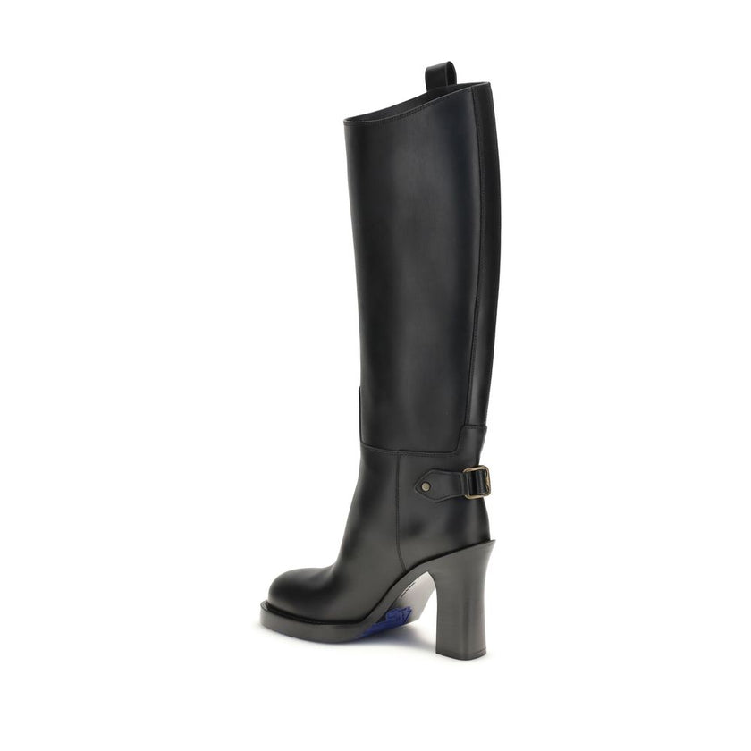 Black Calf Leather Bos Taurus High Heel BootsBurberry’s Cavalier High Boots, inspired by the brand’s equestrian tradition, are crafted in Italy from smooth calfskin. With a column silhouette that reaches to the knee, they feature side tabs, buckled ankle