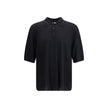 Black Wool Polo ShirtSaint Laurent’s wool polo Shirt is a garment with understated and refined appeal. Featuring a ribbed collar and a three-button front closure, it has ribbed finished hems that complement its structure with elegance. A timeless classic,