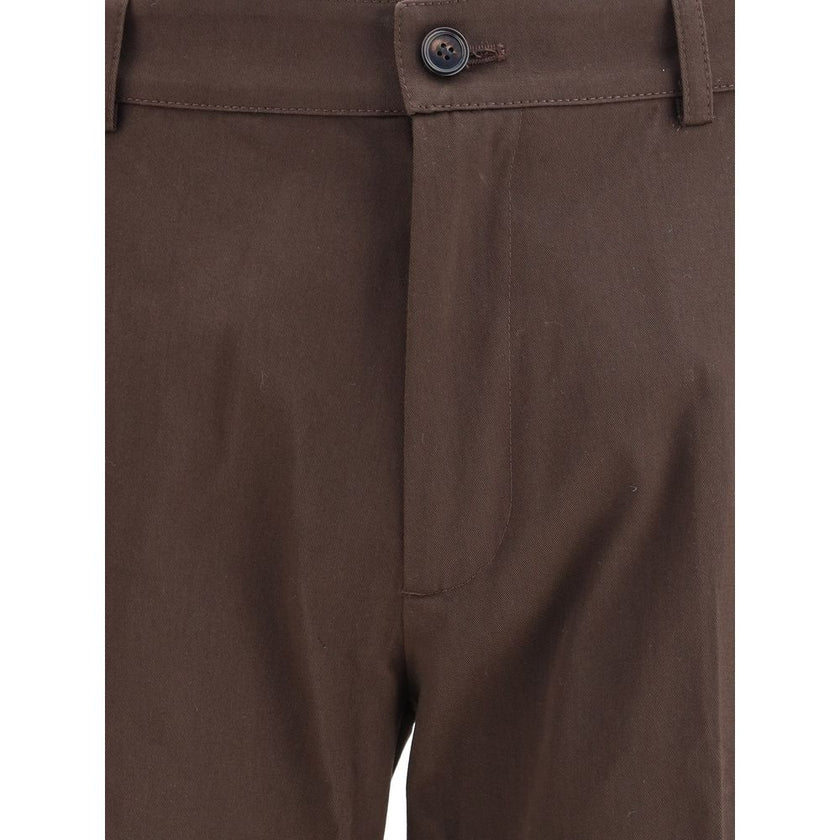Brown Cotton Chino PantsBurberry’s cotton chino Pants reinterpret a wardrobe classic with iconic details from the house. Made of cotton twill with a slim fit, they feature a button and zipper closure, side pouch pockets and a buttoned welt pocket on the b