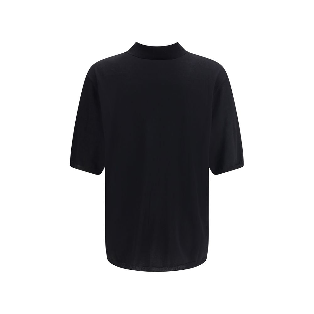 Black Wool Polo ShirtSaint Laurent’s wool polo Shirt is a garment with understated and refined appeal. Featuring a ribbed collar and a three-button front closure, it has ribbed finished hems that complement its structure with elegance. A timeless classic,