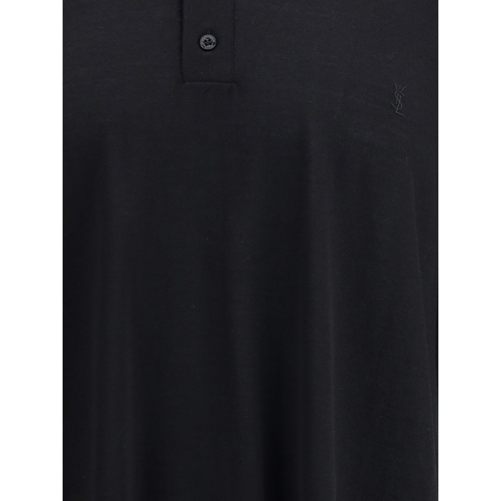 Black Wool Polo ShirtSaint Laurent’s wool polo Shirt is a garment with understated and refined appeal. Featuring a ribbed collar and a three-button front closure, it has ribbed finished hems that complement its structure with elegance. A timeless classic,